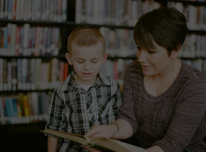monther with a her child showing a book